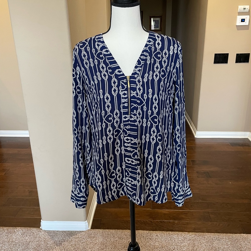 Blue long sleeve blouse with designs